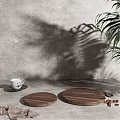Decorative Ornament Set with Wooden Trays White Cup and Plant Shadows on Light Blue Background