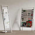 White and Black Metal Display Racks with Newspapers and Magazines on Multiple Layers