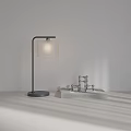 Modern Black Pole Desk Lamp with Light Square Shade on Desk with Books Metal Decor