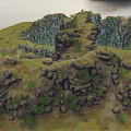 Natural Garden Landscape With Surrounding Rocks Green Vegetation And Small Stream In Depression