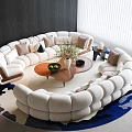Elegant White Curved Sofa and Coffee Table Set With Pillows Plant and Rug