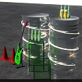 Neon Lit Silver Barrels With Yellow Bottles Green Guitar Red Cones And Metal Racks