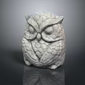 Detailed Stone Owl Sculpture Featuring Textured Feathers And Expressive Eyes