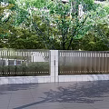Modern Building Facade With Metal Railings Green Plants And Stone Pavement