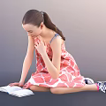 Woman Sitting on Floor Reading Book in Pink Floral Dress with Sneakers and Ponytail