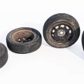 Four Worn Automotive Tires With Metal Rims Arranged On White Background