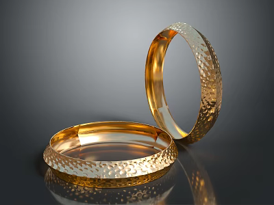 Two Elegant Gold Bracelets With Hammered Textured Surface And Shiny Metallic Look 3d model