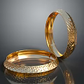 Two Elegant Gold Bracelets With Hammered Textured Surface And Shiny Metallic Look