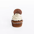 Delicious Cupcake With Swirled Vanilla Frosting Topped With Oreo Cookie and Brown Paper Liner