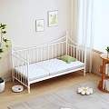 White Metal Bed Frame with Green Pillow and White Mattress on Wooden Floor