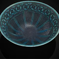 Turquoise Ceramic Bowl Featuring Intricate Decorative Patterns And Light Colored Base