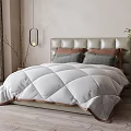 Serene Bedroom Interior With Tufted Headboard Quilted Comforter And Gray Brown Pillows