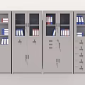 Gray Metal Bookcases With Glass Doors Storing Organized Folders And Books