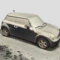Snow Covered Compact Car Parked On Snowy Ground With Footprints Around