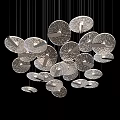Artistic Modern Chandelier With Circular Textured Discs Hanging As Decorative Ceiling Light