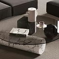 Glass Top Coffee Table with White Marble Base Black Sofa Teapot and Striped Book