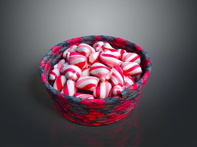 Red and white striped candy arranged in red and black woven basket 3d model