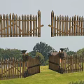 Wooden Fence Gate With Spiked Tops And Decorative Design In Grassland With Trees