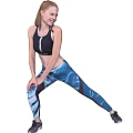 Woman Performing Stretching Exercise In Black Sports Bra And Blue Printed Leggings For Fitness Training
