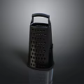 Black Kitchen Grater Appliance Featuring Handle And Perforated Design For Cheese And Vegetables