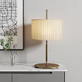 Elegant Table Lamp with Pleated Fabric Shade Wooden Pole on Marble Tabletop and Green Plant