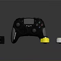 Black Game Controller With Display And Small Accessories Including Yellow White Components
