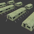 Multiple Green Military Tents In Canvas Material With Ropes And Frames