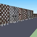 Modern Multi Story Residential Buildings With Varied Colored Facades Windows And Blue Sky