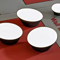 Four Modern Wall Lamps with White Shade and Dark Base on Red Gray Background