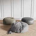 Stylish Round Gray Brown Fabric Leather Ottomans With Textured Blanket On Wooden Floor Minimalist Setting