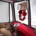Vintage Volkswagen Bus Model With Red And White Exterior Open Doors And Green Seats