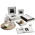 Stacked Books And Open Magazines With Photo Frames And Decorative Ornaments On Tabletop