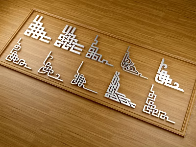 Metal Corner Moldings With Various Traditional Geometric Patterns Arranged On Wooden Tabletop 3d model