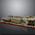 Handmade Wood and Stone Craft Pieces with Rough Surfaces on Red Display Base