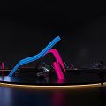 Vibrant Neon Art Installation With Blue Pink Curved Lines On Circular Platform