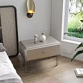 Elegant Modern Nightstand with Silver Finish Metal Legs and Decorative Figurine Vase Near Window
