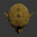 Intricate Golden Mask Sculpture With Detailed Carving Patterns And Decorative Top