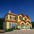 Elegant Yellow Twin Villa Exterior With Orange Roof Arched Porch And Green Lawn