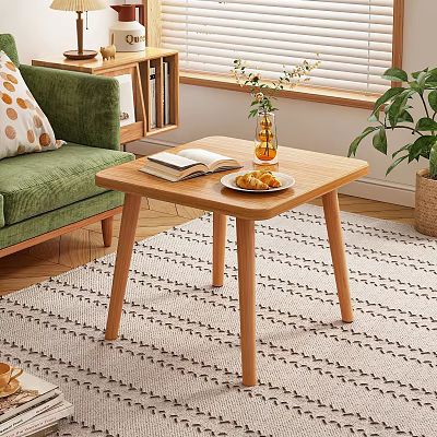 Wooden Coffee Table With Open Book Pastry Plate Flower Vase And Green Sofa In Living Room 3d model