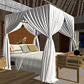 Hotel Room Featuring Four Poster Bed White Drapes Wooden Furniture and Brick Wall