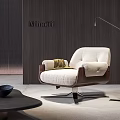 Minotti White Cushioned Lounge Chair With Wooden Arms Floor Lamp And Black Side Table
