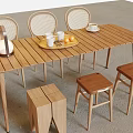 Wooden Outdoor Table with Rattan Chairs Tray Fruits Cups and Stools