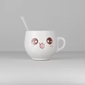 White Cup With Cute Cartoon Smiling Face And White Spoon Beside Simple Gray Background