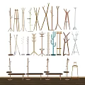 Various Wooden Metal Clothes Hangers With Plant Geometric Shapes On White Wall And Bench