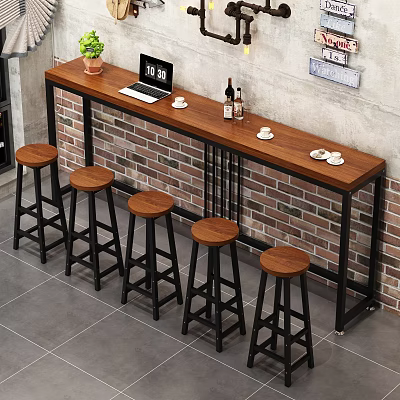 Wooden Bar Counter Featuring Black Metal Frame Stools Laptop Coffee Cups and Green Plant 3d model