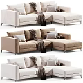 Modern L Shaped Upholstered Sofa in Neutral Tones With Throw Blanket Decorative Pillows and Balls