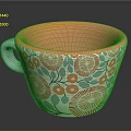Colorful Ceramic Mug with Orange Interior Blue Handle and Red Floral Green Leaf Patterns