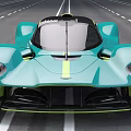 Turquoise Supercar with Sleek Aerodynamic Design and Yellow Accents Cruising on Highway