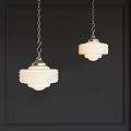 Two Classic Chandeliers With White Glass Shades And Silver Metal Chains Hanging On Dark Wall