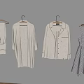 Light Clothes Hanging On Gray Background Featuring Loungewear Cardigan Shirt Jacket And Polka Dot Dress